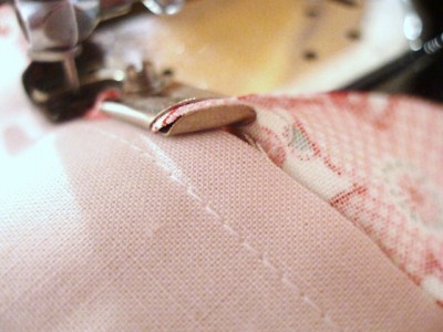 Bias is fed, folded, stitched and bound in place Bias is fed, folded, stitched and bound in place