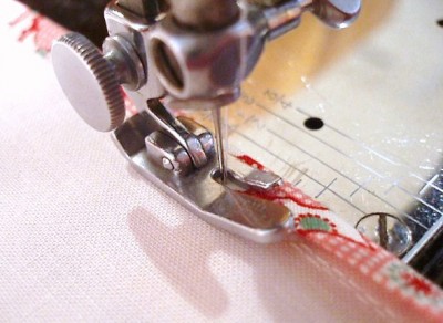 Stitching the bias-binding in place Stitching the bias-binding in place.