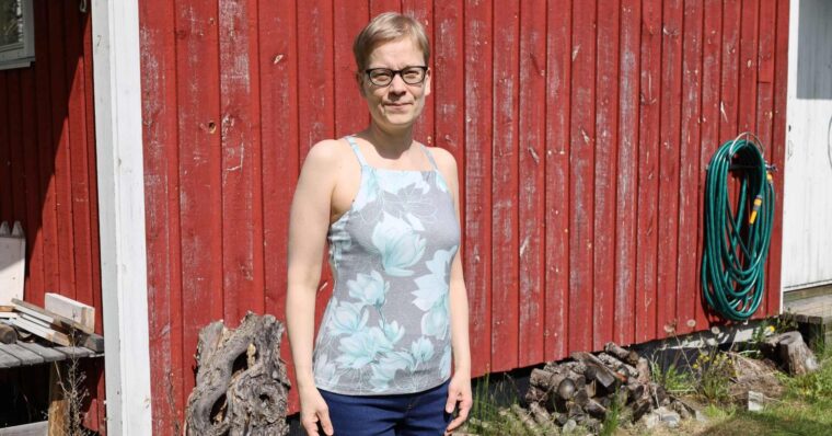 Woman standing in front of a barn wearing Liesl + Co Tribeca Knit Cami