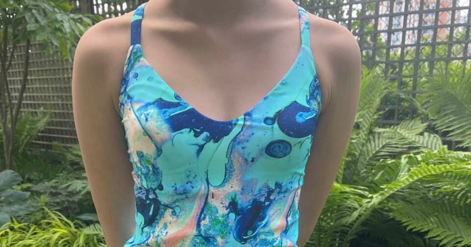 Teen girl wearing swimwear top made from Liesl + Co Tribeca Cami Pattern