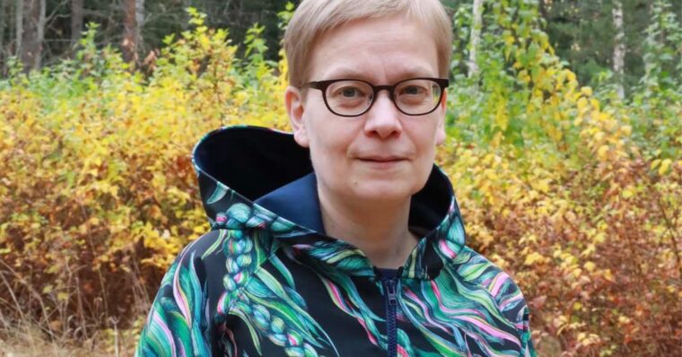 Close up of woman wearing colorful handmade waterproof jacket